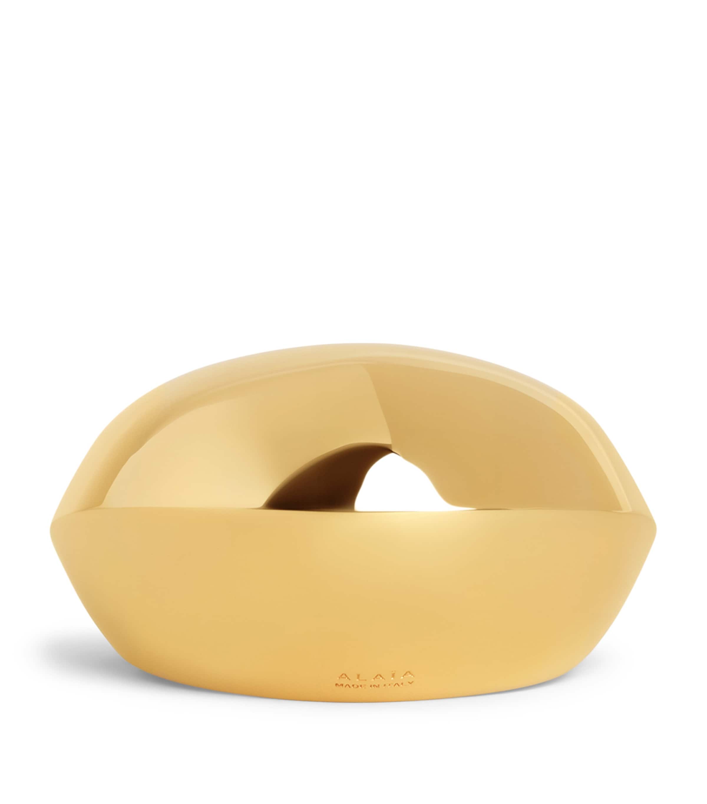 Alaïa Aluminium Dome Cuff Bracelet Yellow Gold Metals