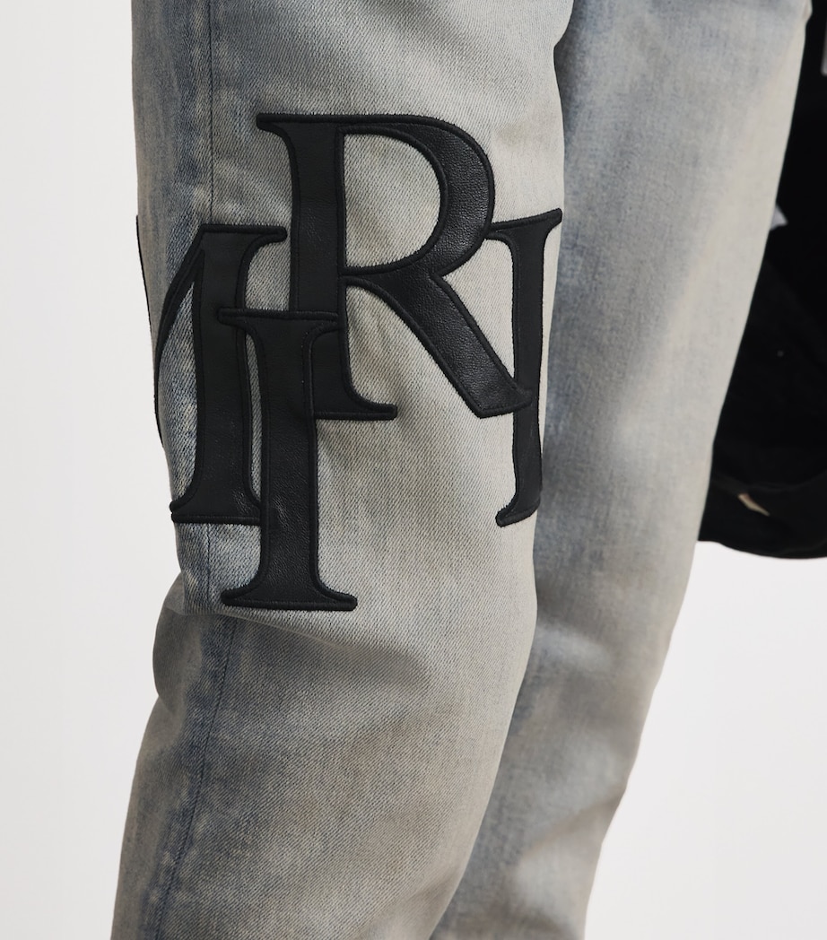 AMIRI Mens Staggered Logo Skinny Jeans Antique Indigo Black Image 3