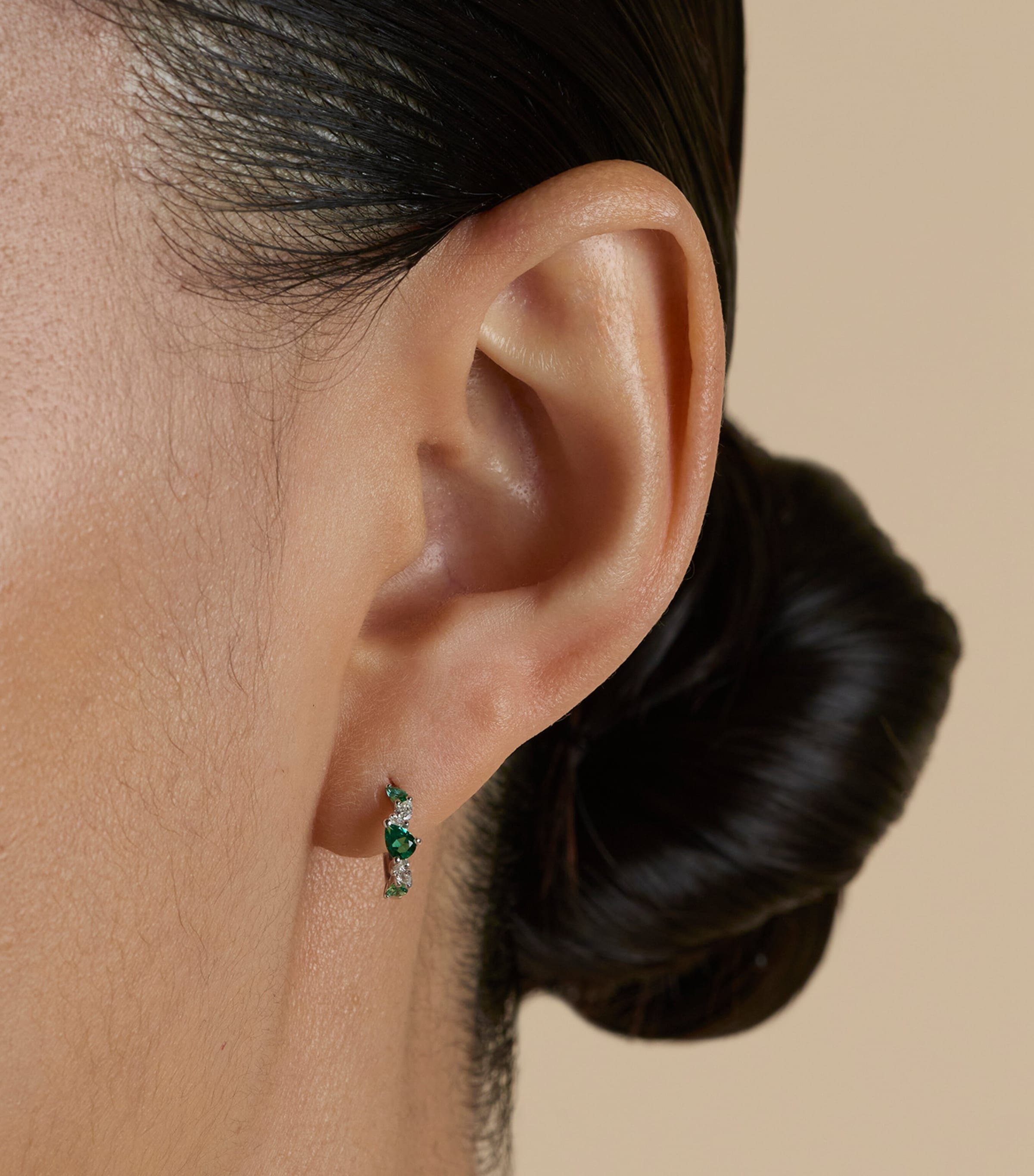 Astrid & Miyu White Gold, Diamond and Emerald Huggie Hoops White Gold Image 2