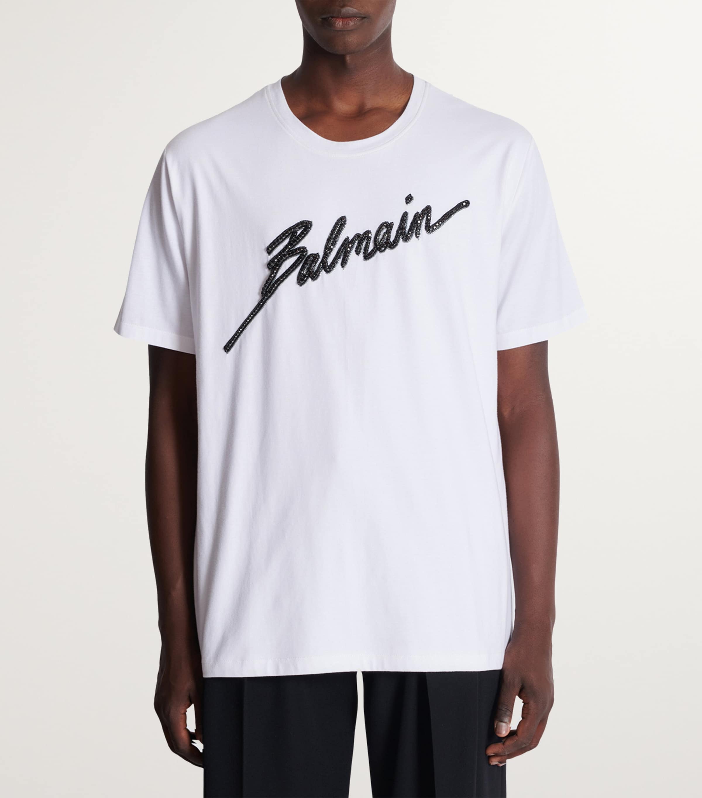 Tシャツ・カットソー BALMAIN EMBROIDERED LOGO COTTON BLEND TOP Embroidered Balmain Signature T-shirt - Men | BALMAIN