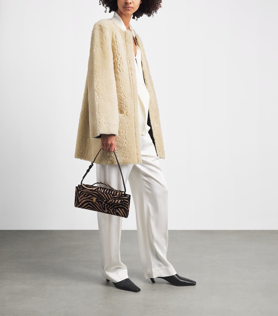 Stylein Ivory Shearling-Leather Reversible Veda Coat | Harrods UK