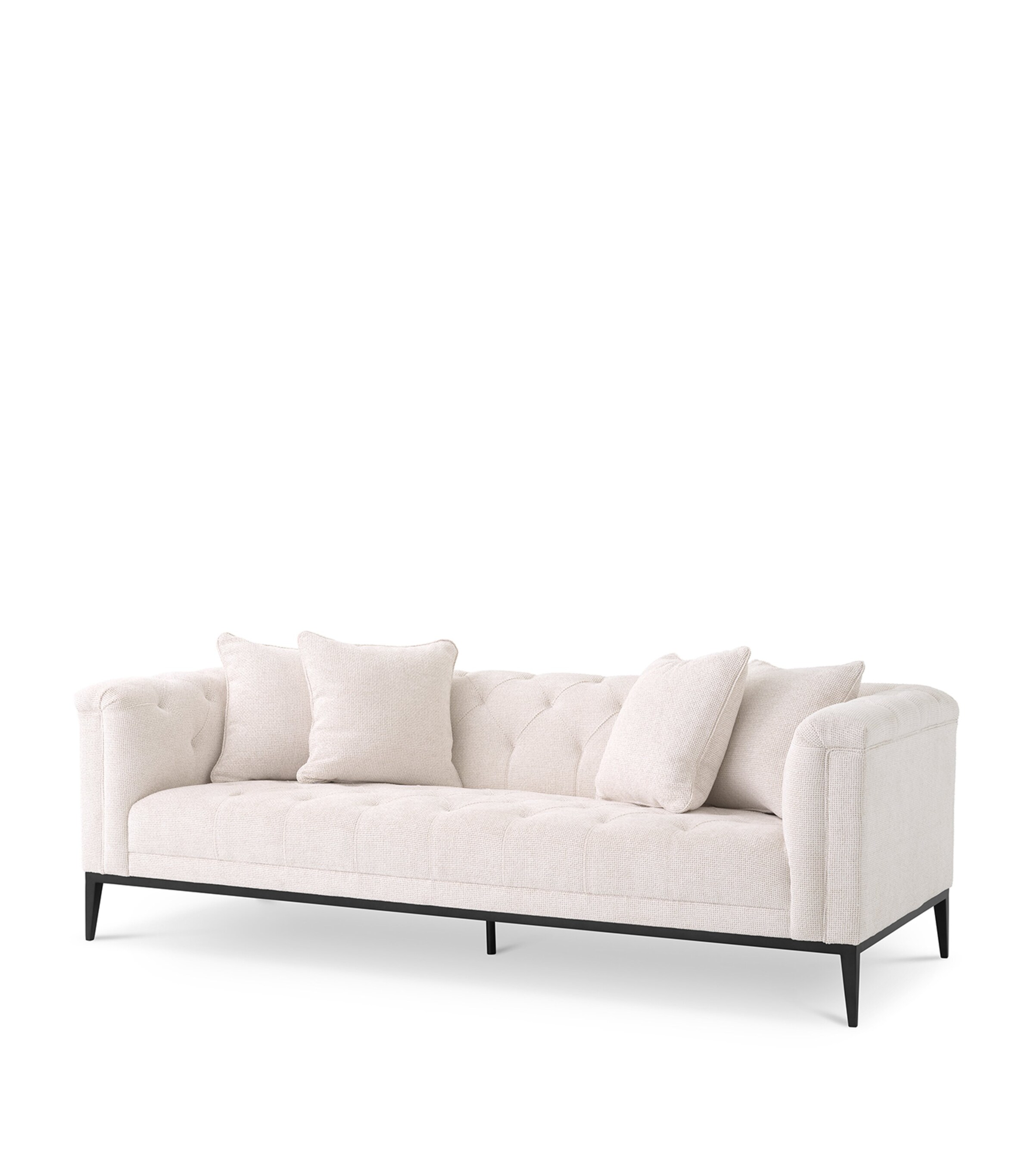 Beige tufted sofa with cushions shown from a different angle