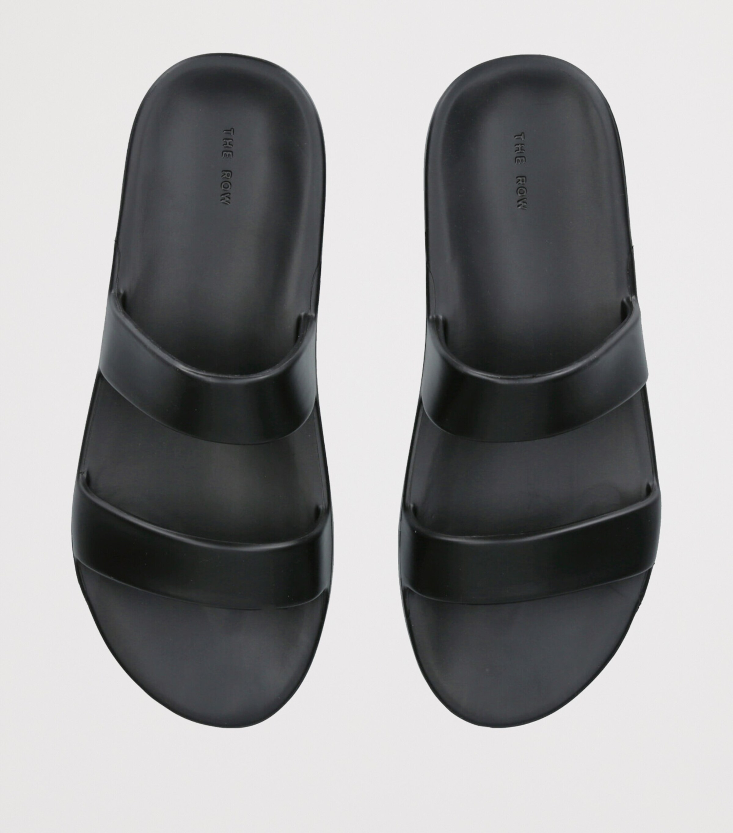 サンダル・ミュール THE ROW Foam flat sandals in rubber The Row Foam Sandal in Black | FWRD