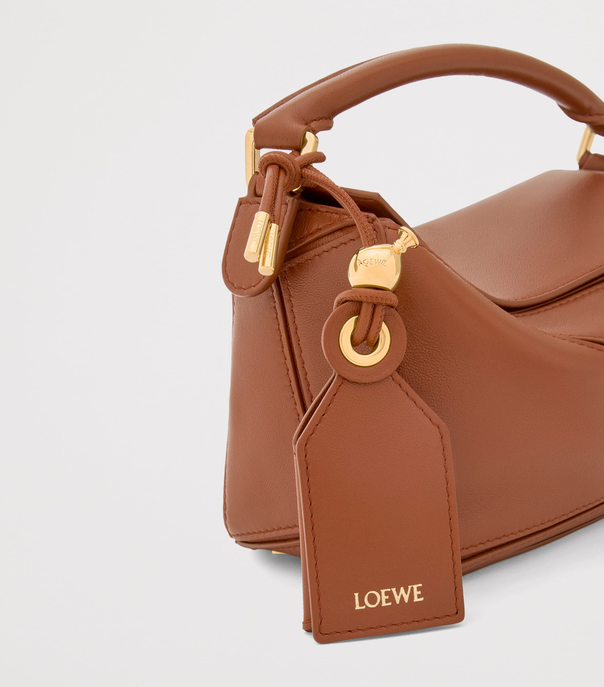 LOEWE ブラウンレザー ハンドバッグ LOEWE Brown Mini Leather Puzzle Top-Handle Bag | Harrods US