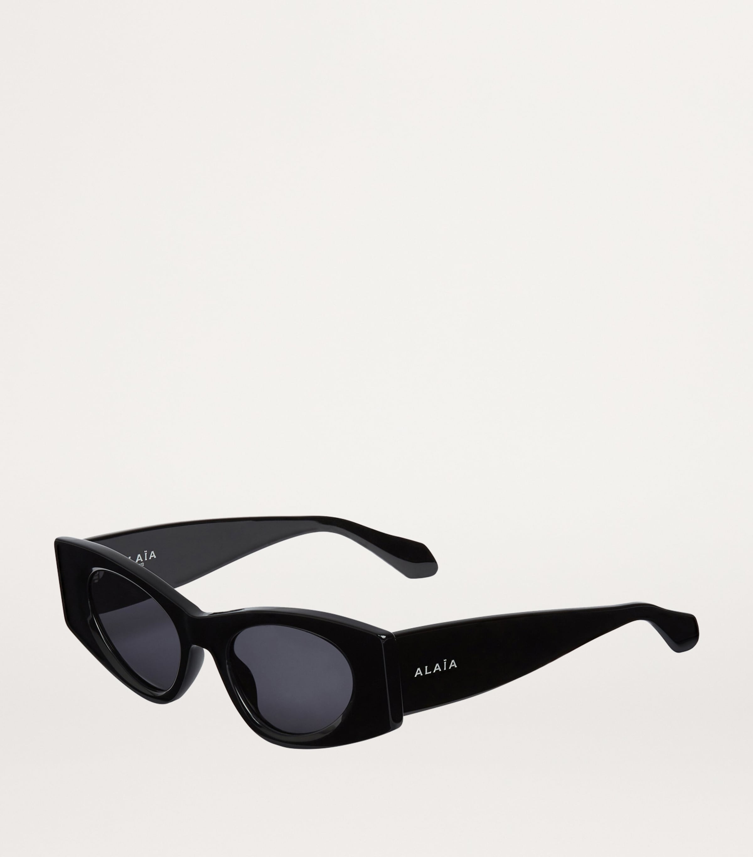 Alaïa Black Cat Eye Sunglasses | Harrods US display picture 2