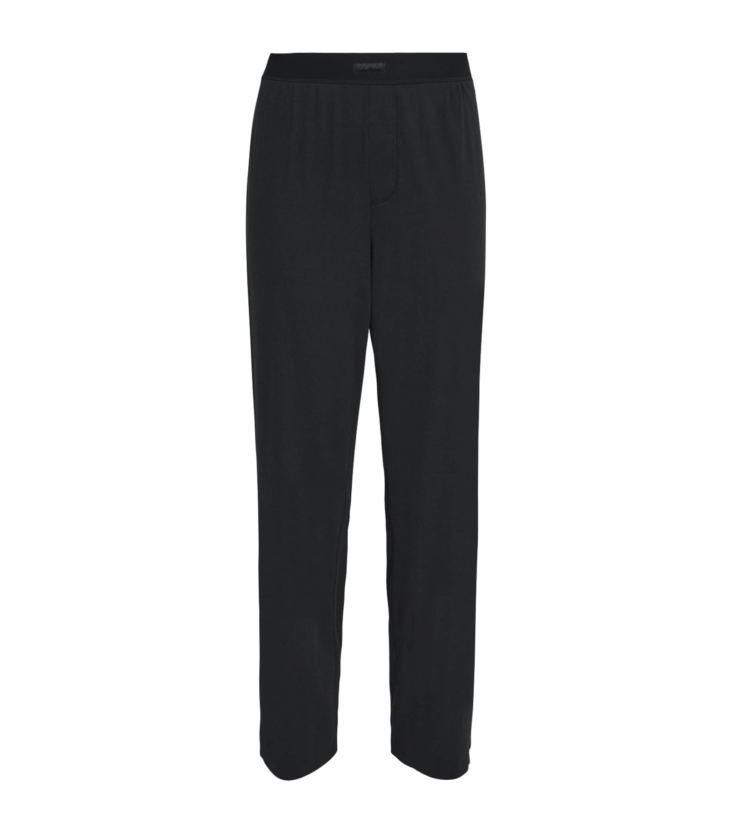 Skims Stretch-cotton Ribbed Trousers In Black