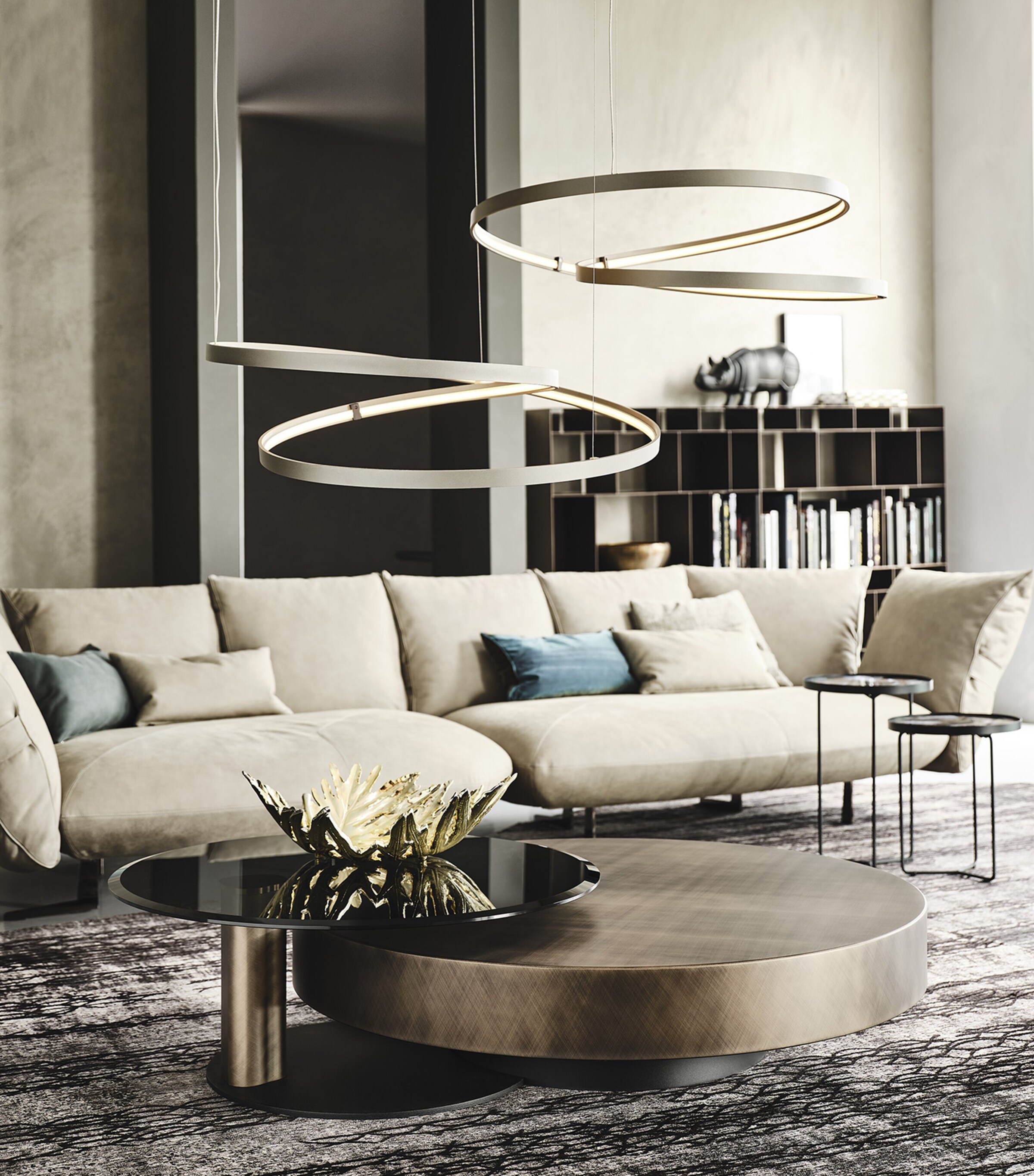 Contemporary living room with circular coffee table and sculptural light fixtures