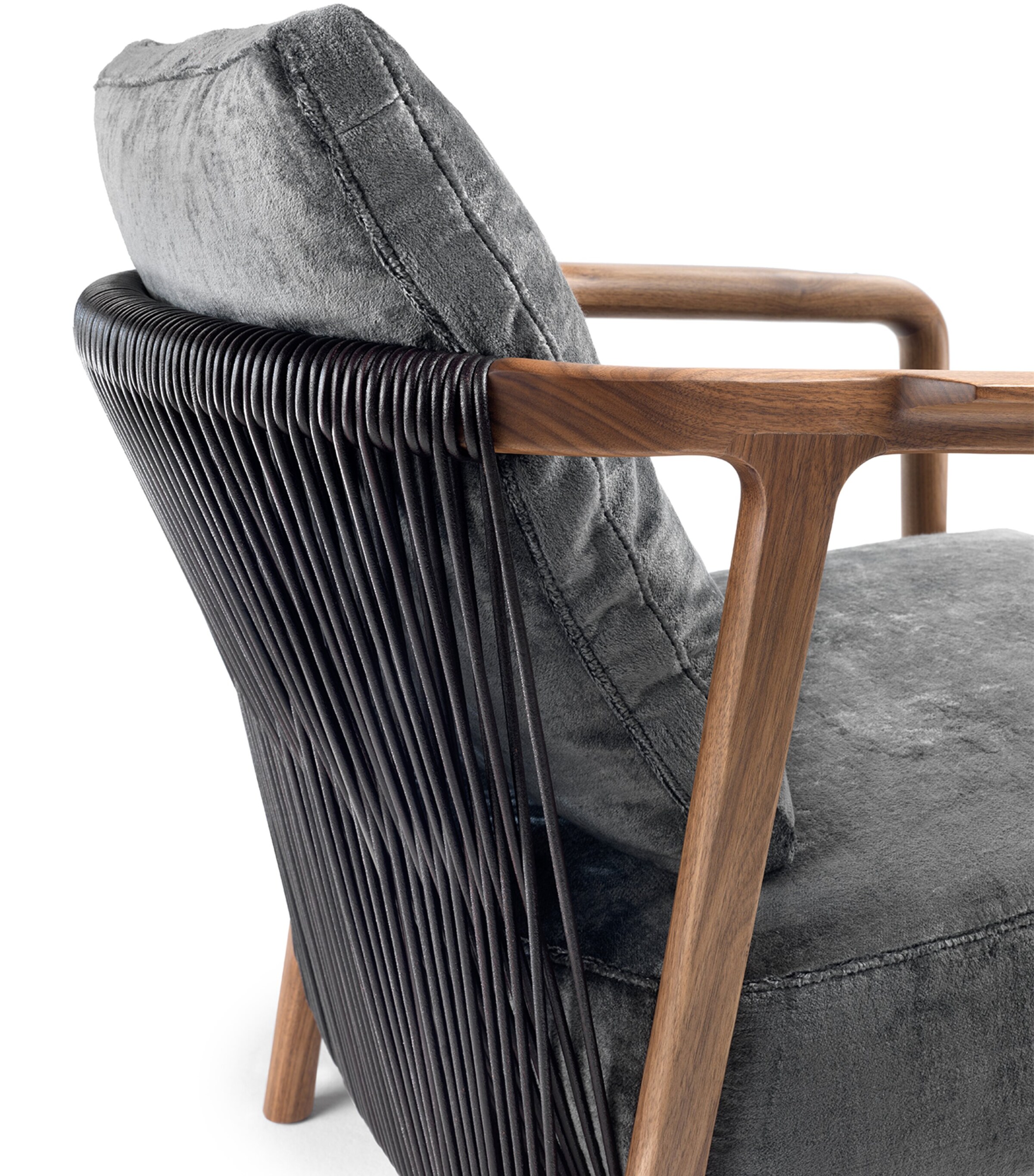 Close-up of Crono armchair armrest and woven cord back in dark material