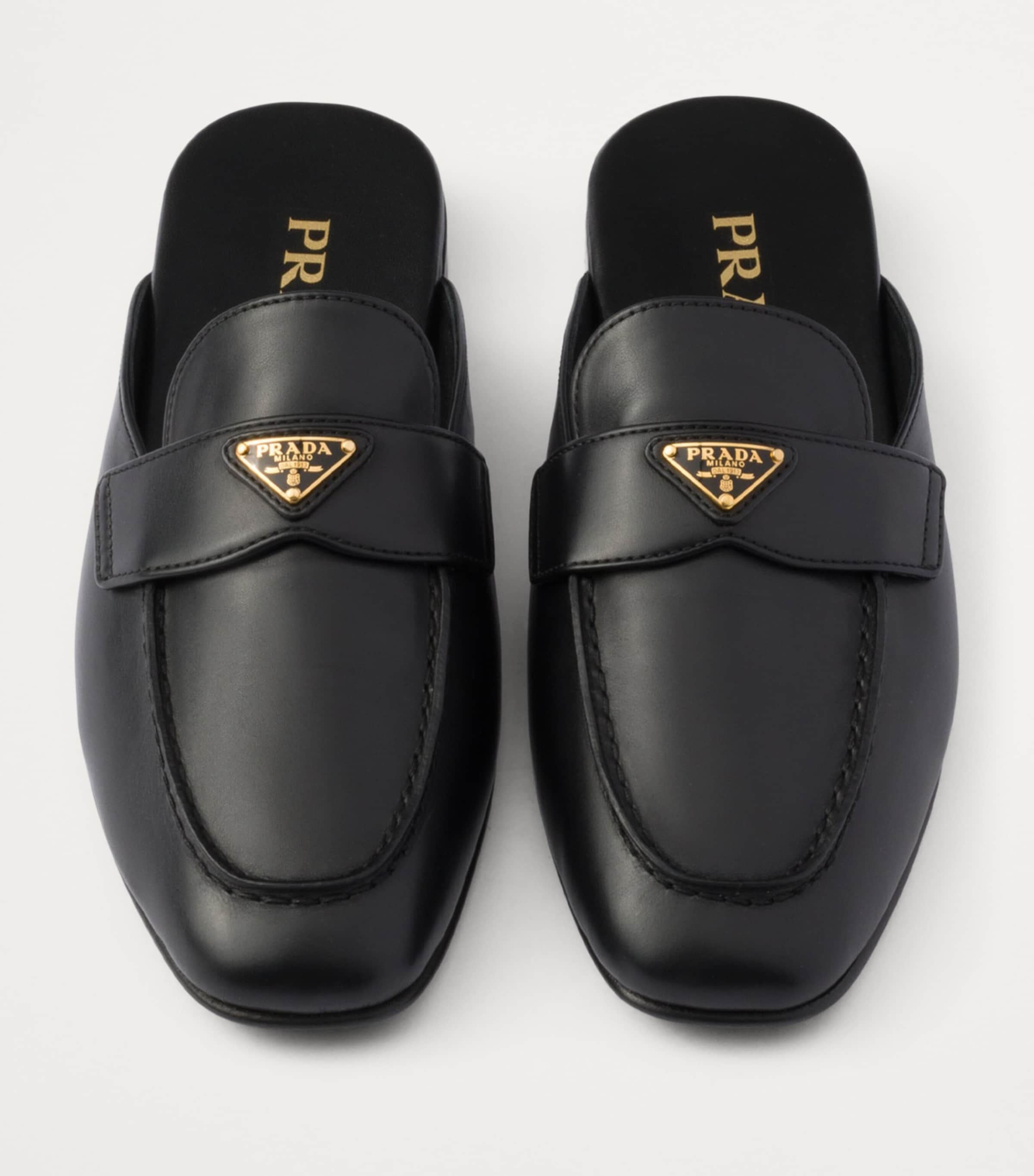 Prada Black Leather Triangle Slippers | Harrods UK