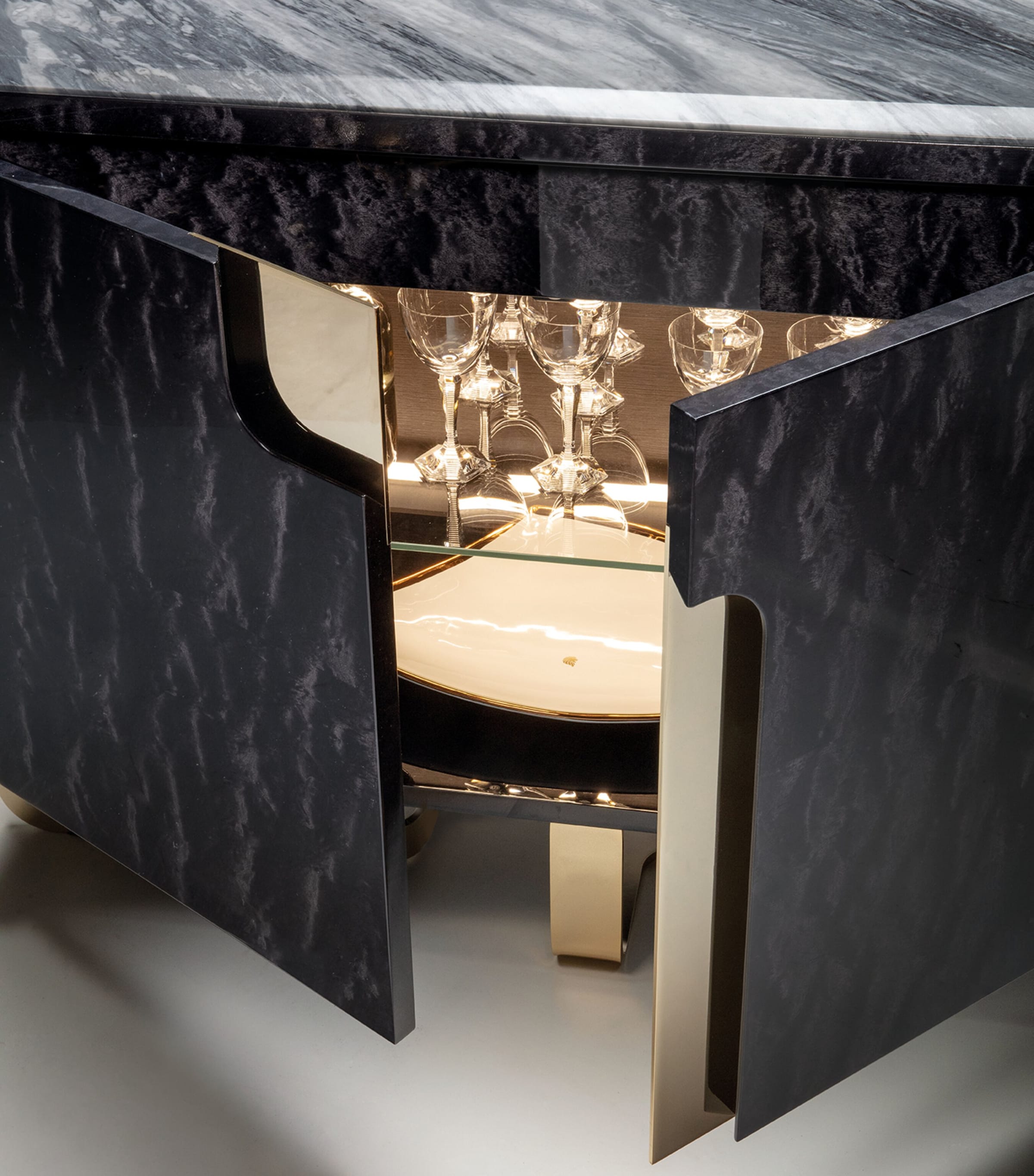 Open cabinet doors of Charisma Buffet showing gold interior