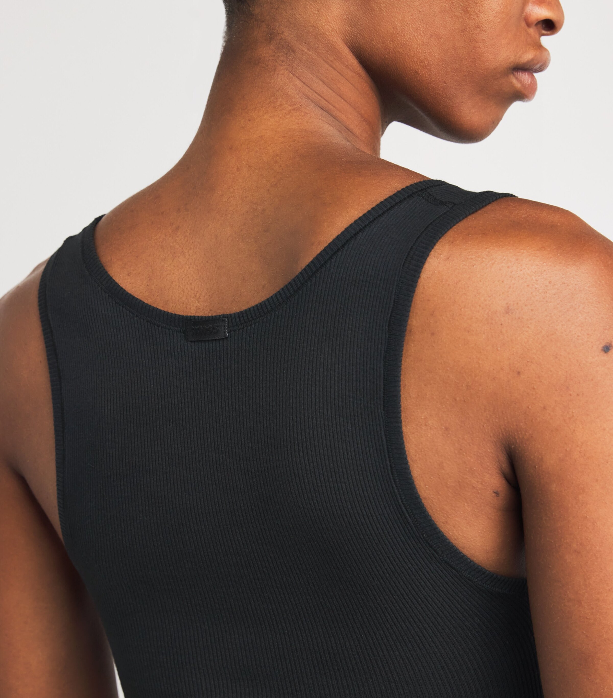 Skims Black Cotton Ribbed Cropped Tank Top | Harrods US Skims Black Cotton Ribbed Cropped Tank Top | Harrods US