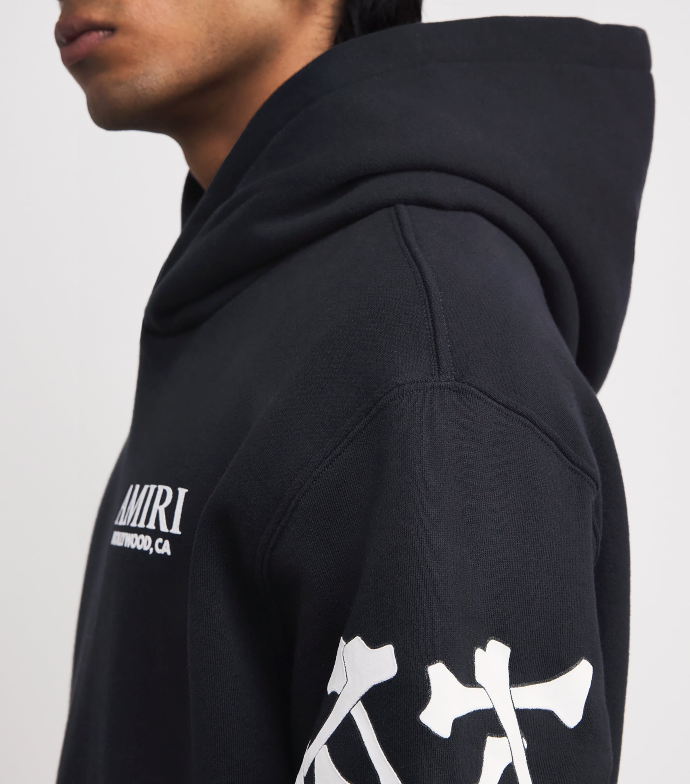 関税負担なし◆AMIRI◆Stacked Bones コットンフーディー ロゴ AMIRI Cotton Bones Stacked Hoodie | Harrods US