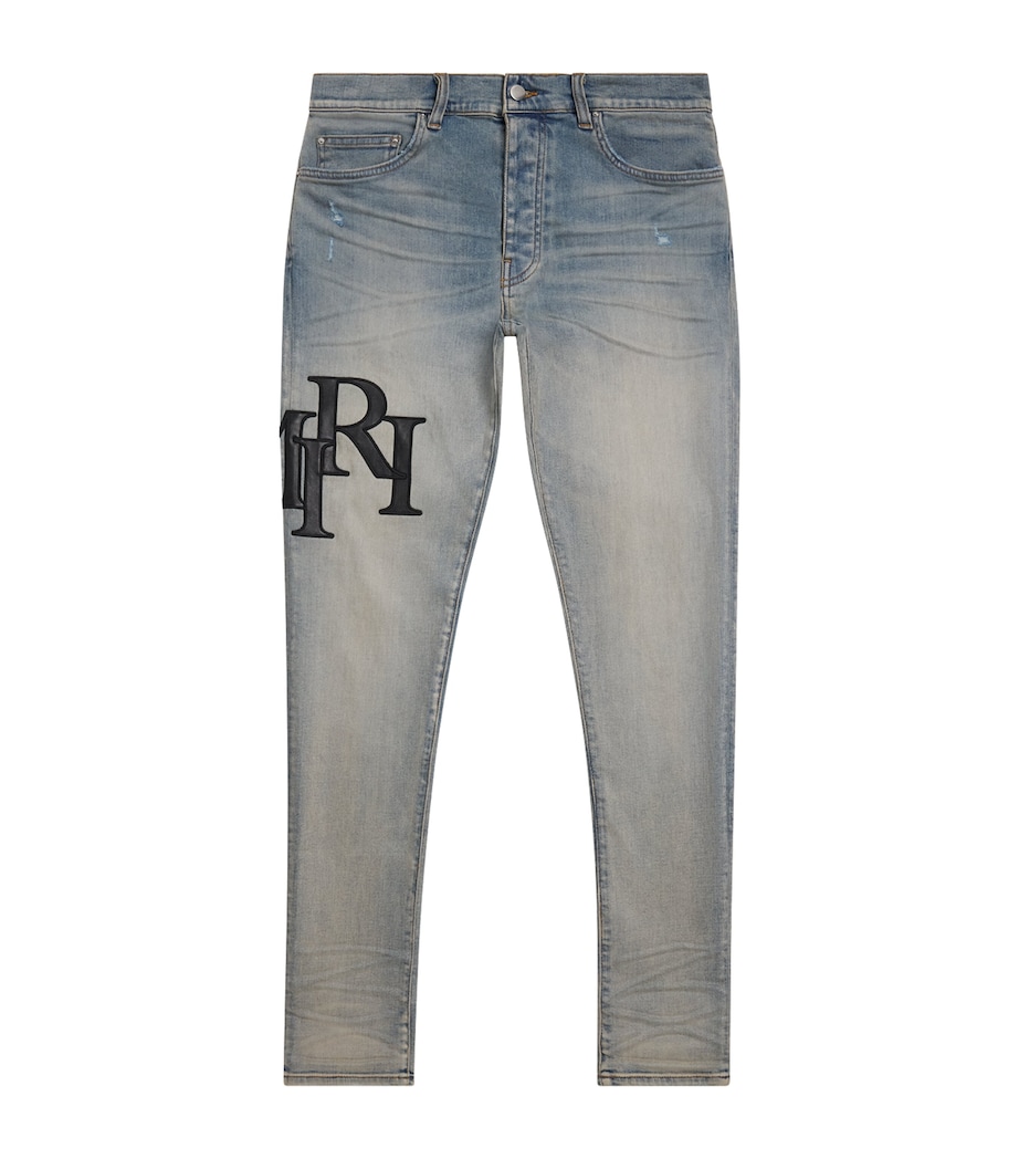 AMIRI Mens Staggered Logo Skinny Jeans Antique Indigo Black Image 1