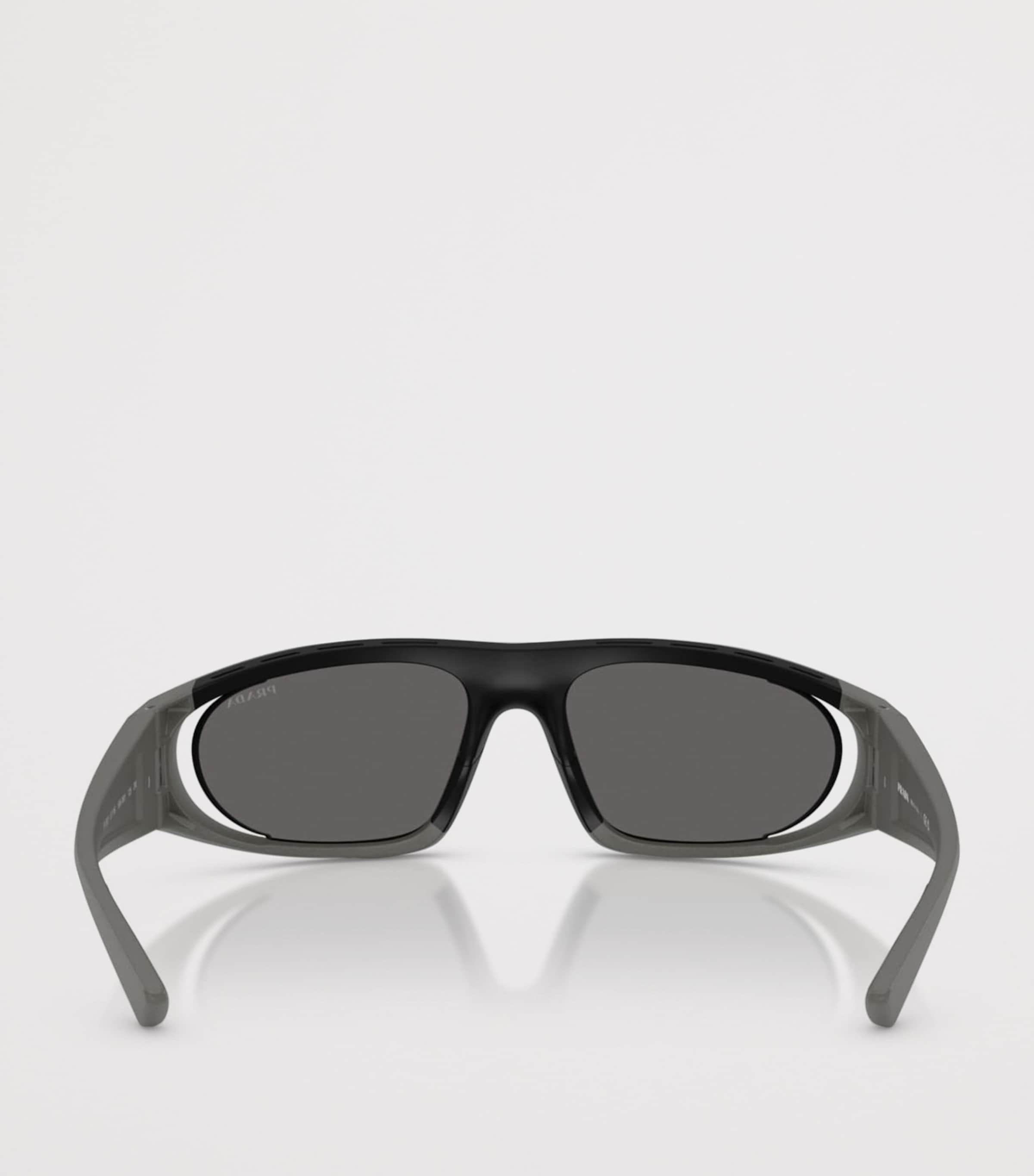 Prada Linea Rossa Irregular Sunglasses In Grey