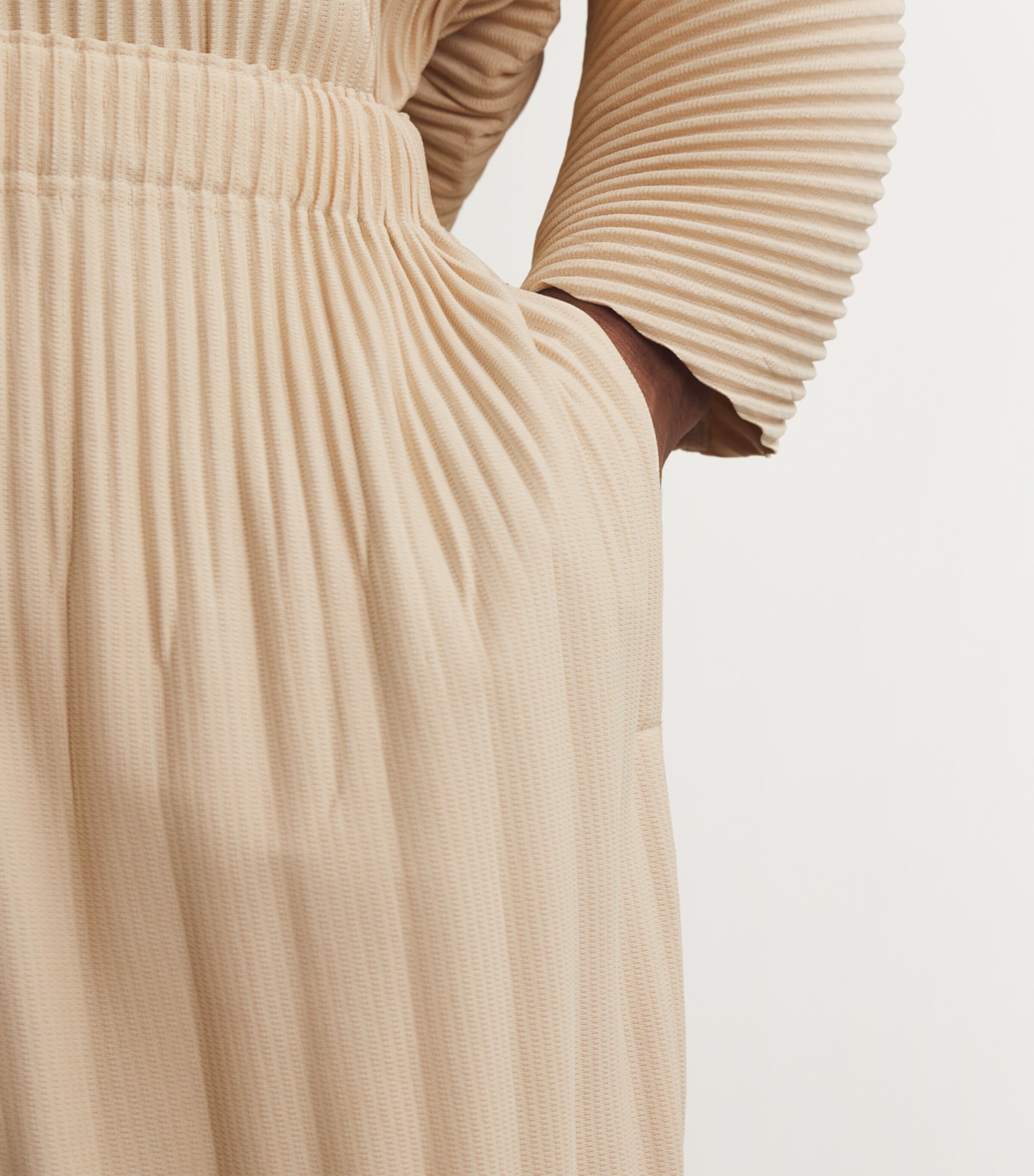 Homme Plissé Issey Miyake Beige Pleated Tapered Trousers | Harrods UK
