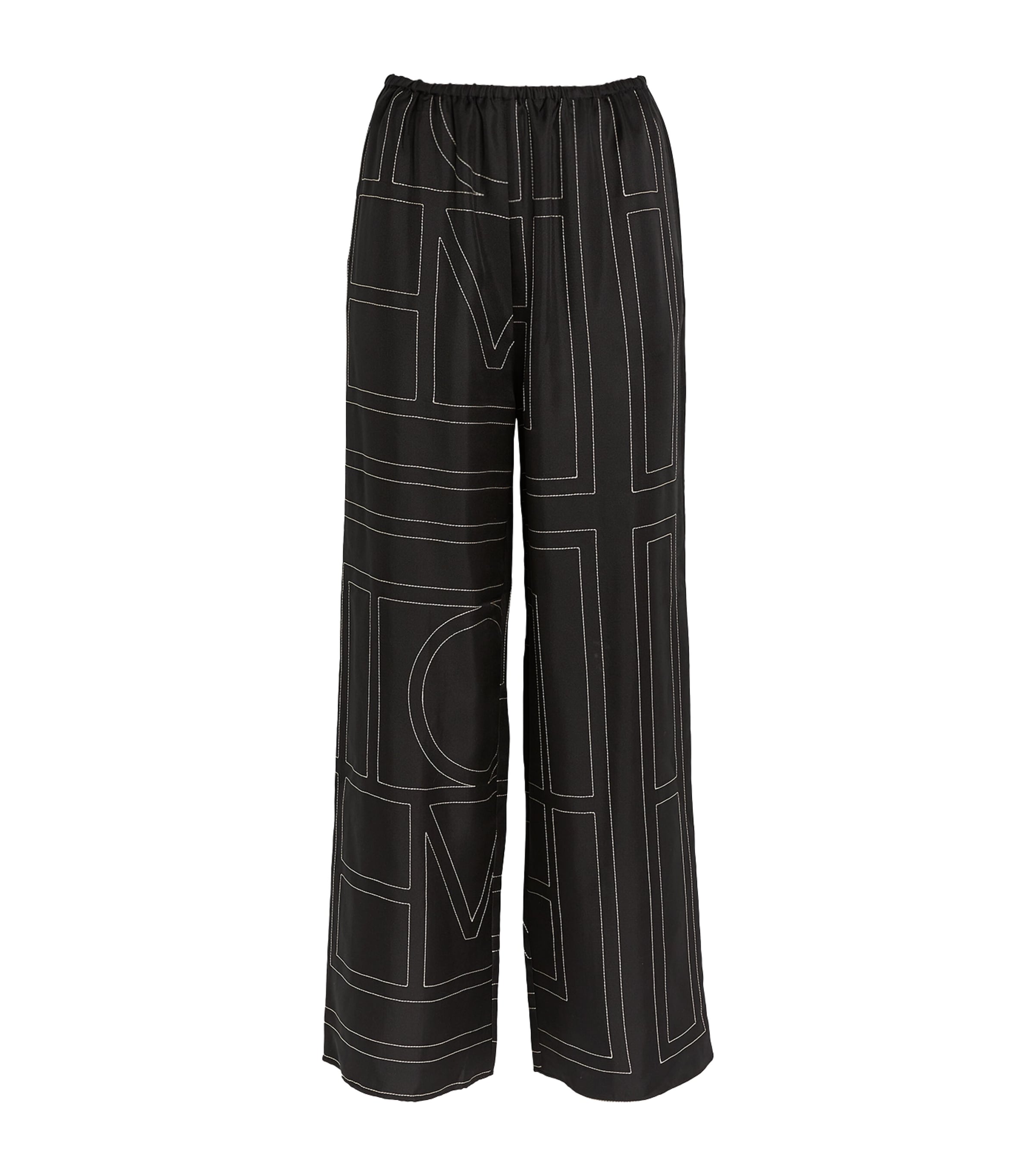 Shop Totême Silk Monogram Trousers In Black