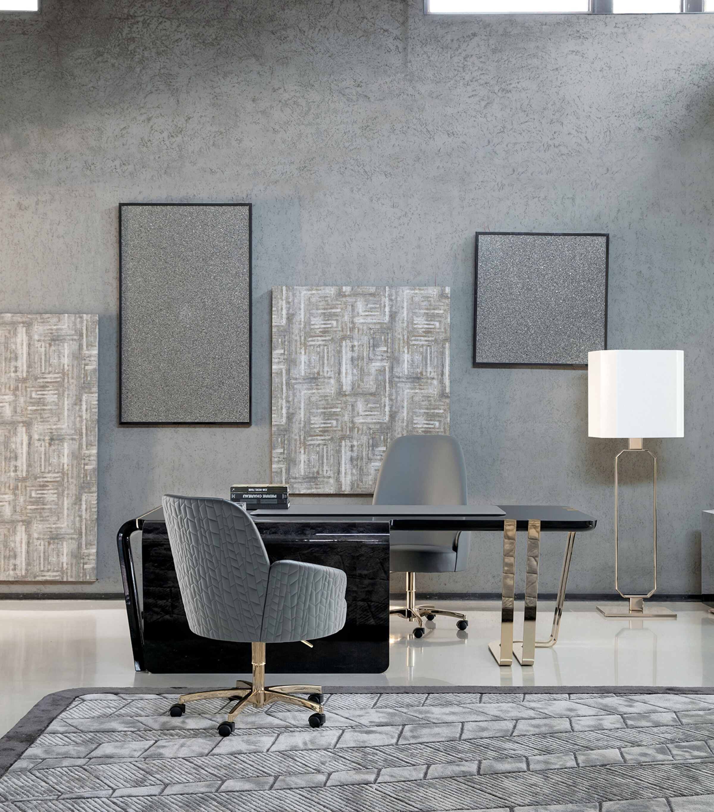 Desk with chair and wall art in modern showroom