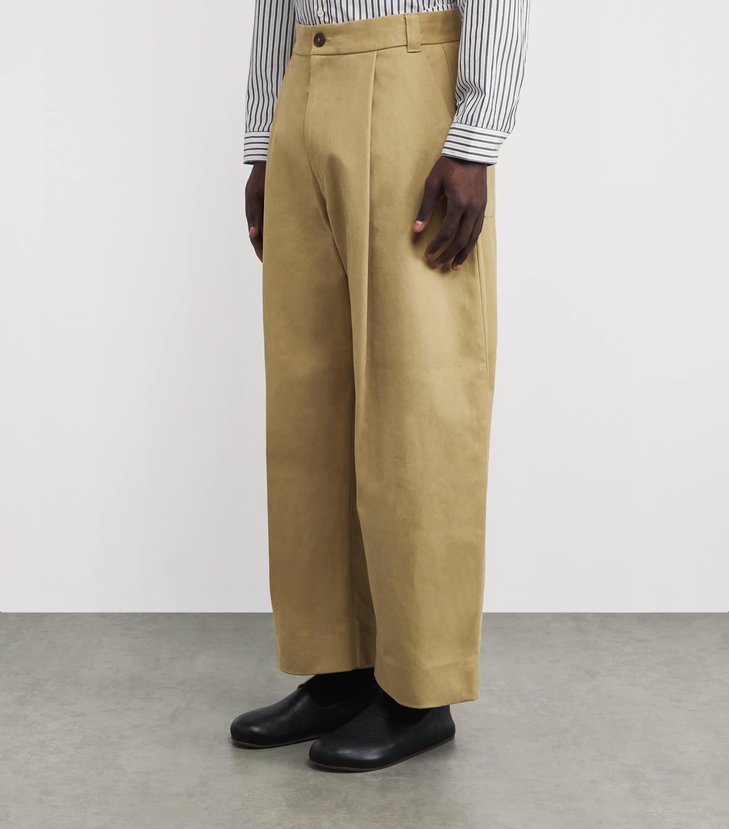 Studio Nicholson Beige Cotton Pleated Sorte Trousers | Harrods UK