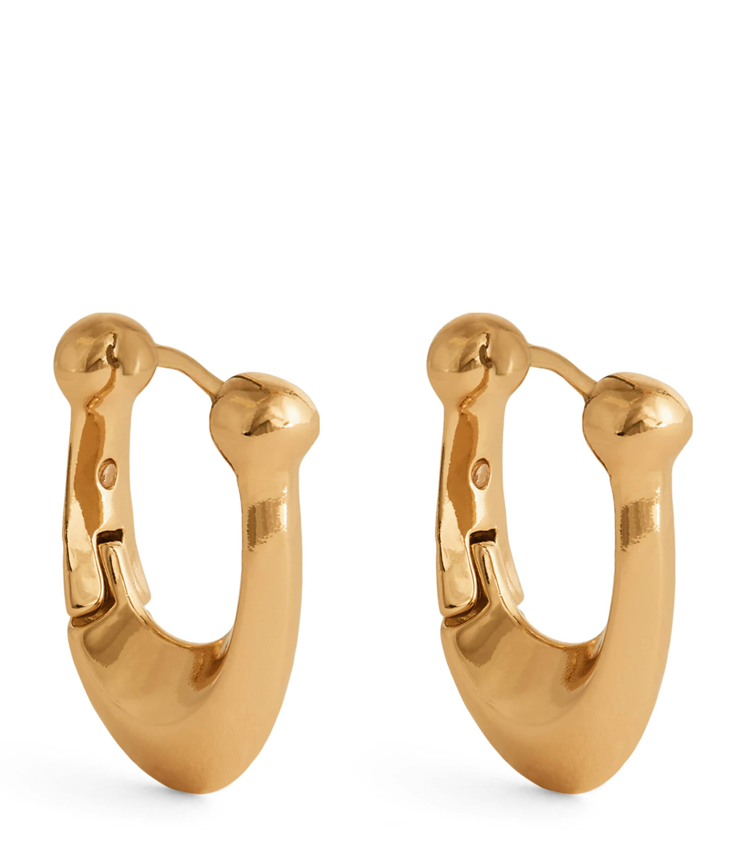 Shop Coach Brass Signature C Huggie Earrings In Gold