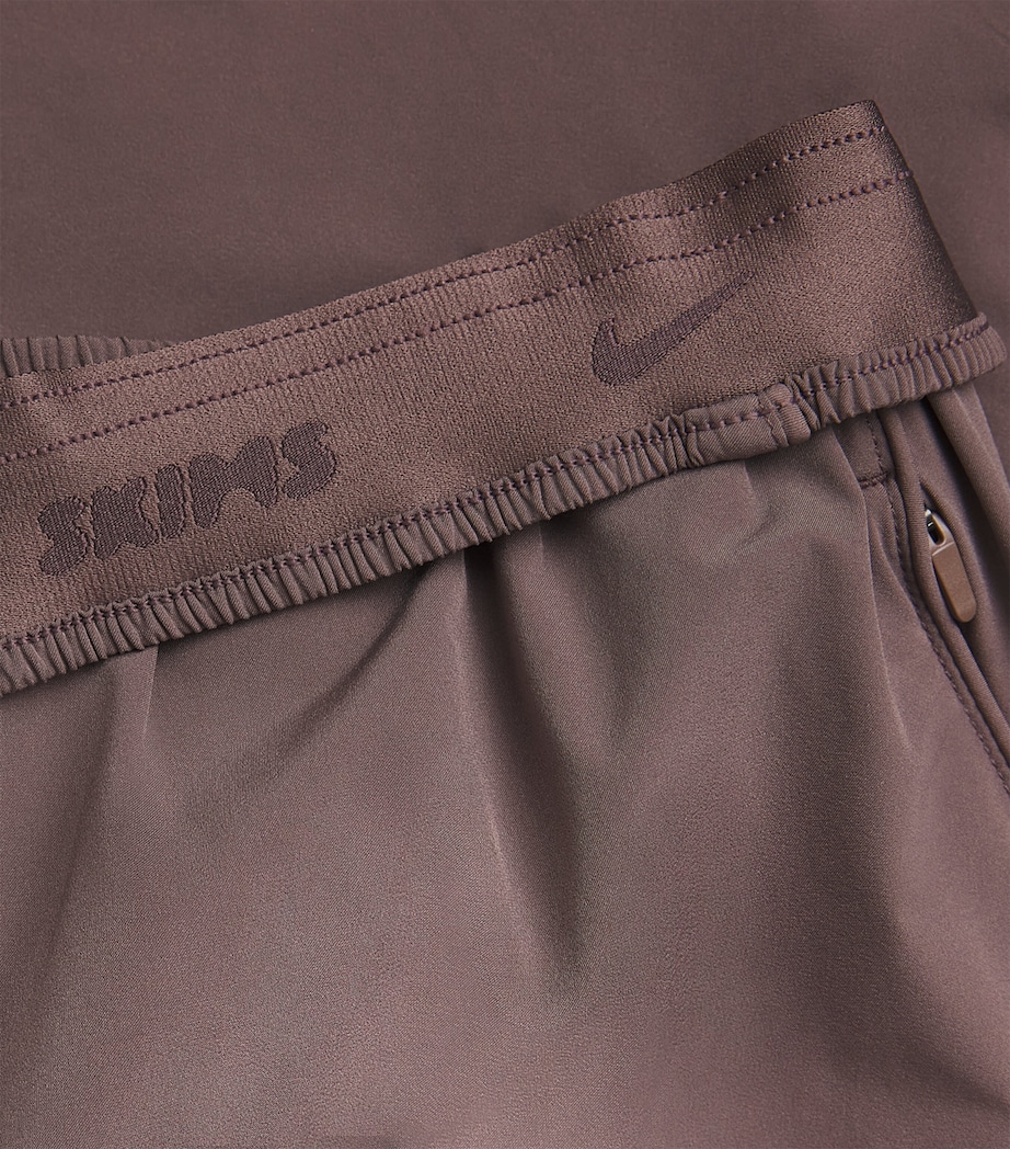 NikeSKIMS Womens NikeSKIMS Oversized Track Pants Resin Image 2