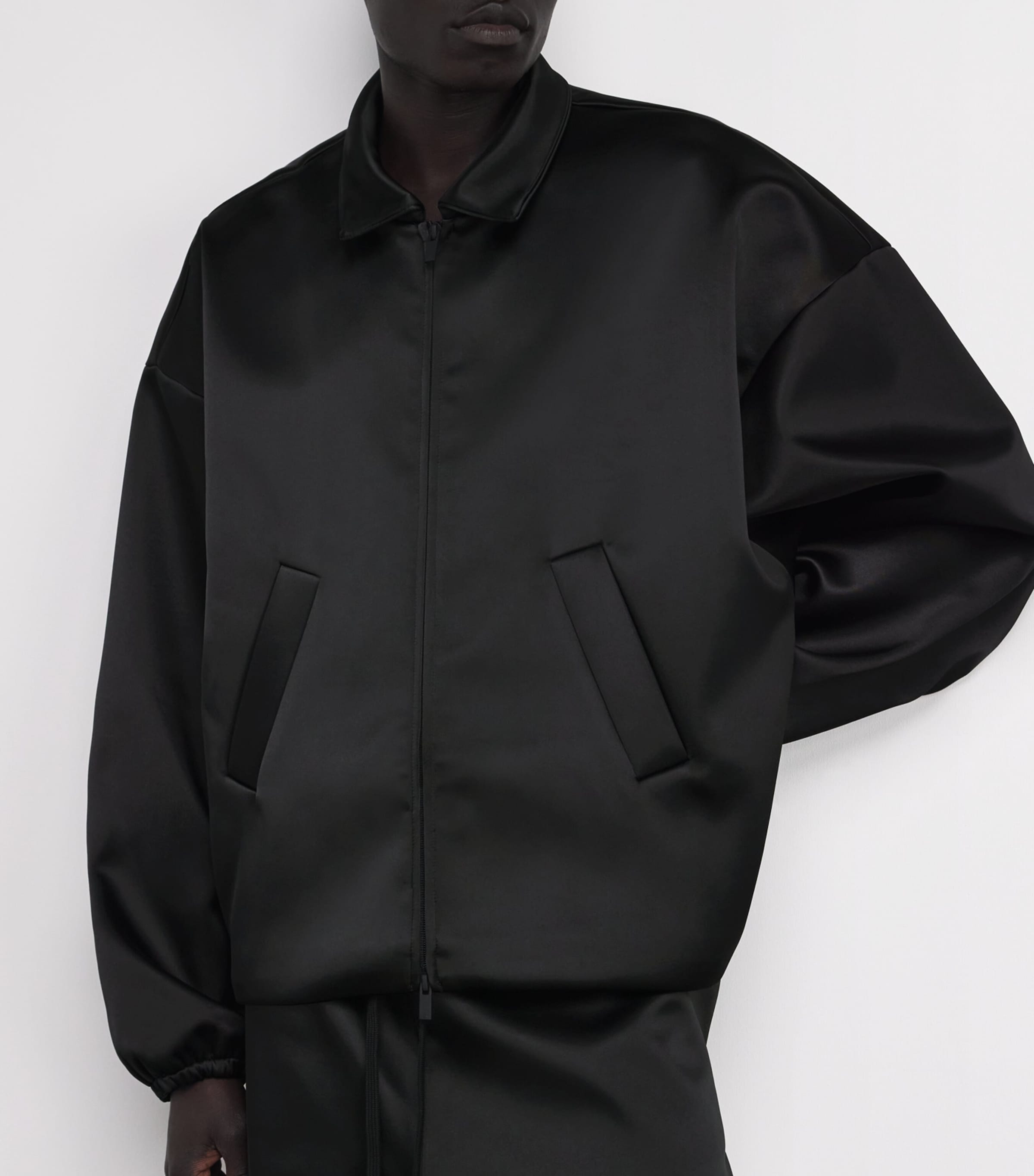 FEAR OF GOD ESSENTIALS Black Bonded Satin Bomber Jacket | Harrods UK