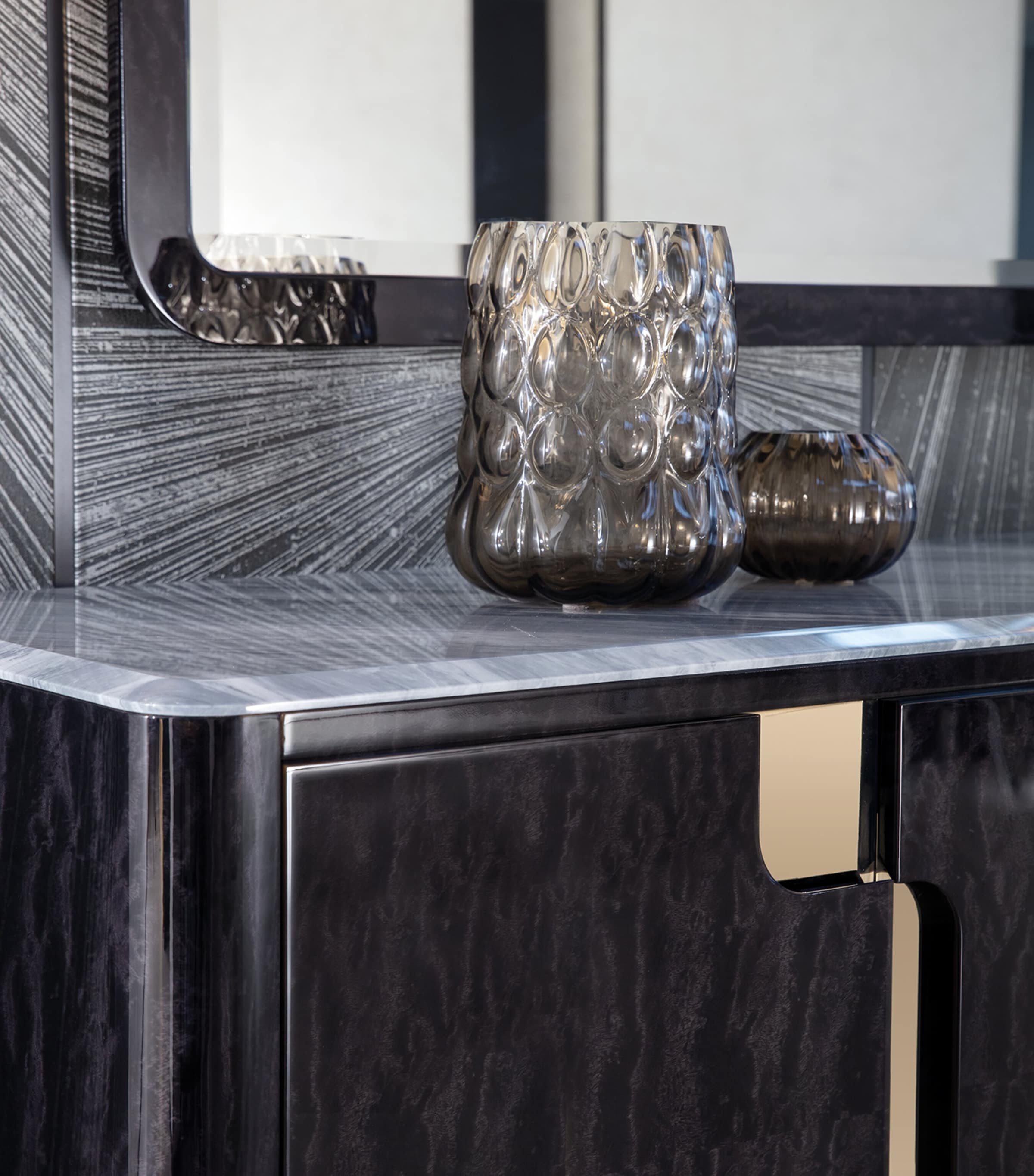 Close-up of countertop and decorative vases on Charisma Buffet