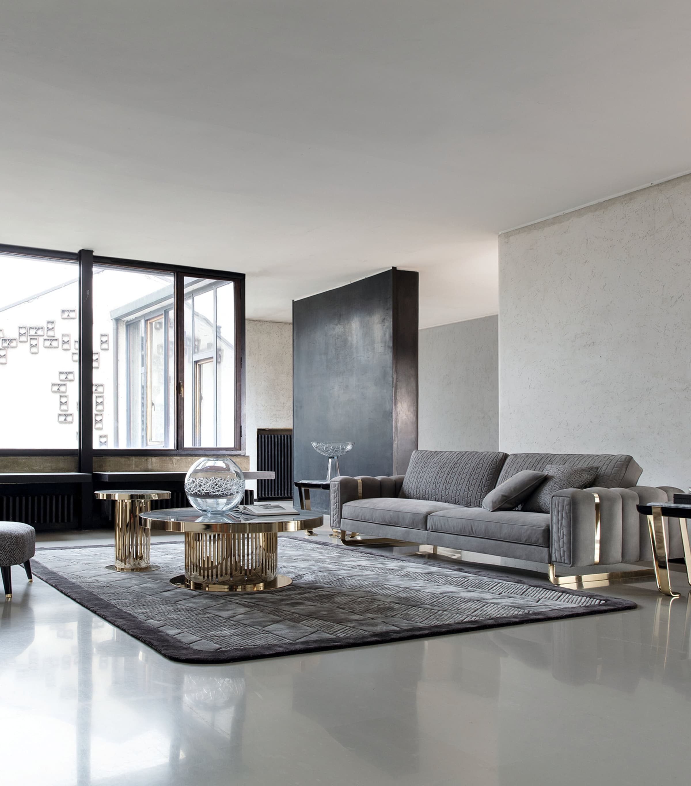 Living room with Giorgio Charisma sofa and circular coffee tables