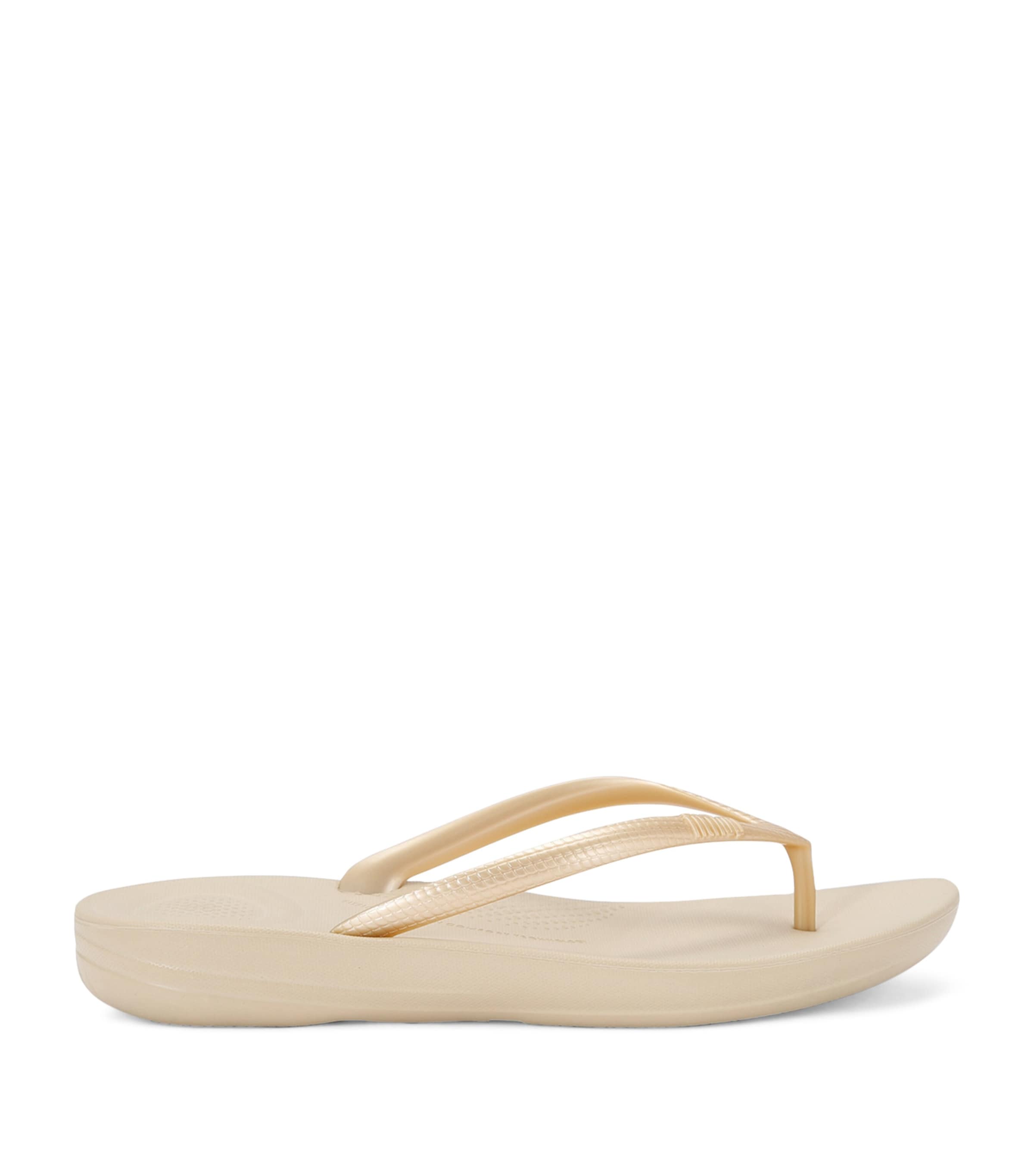 Shop Fitflop Iqushion Flip Flops 30 In Gold