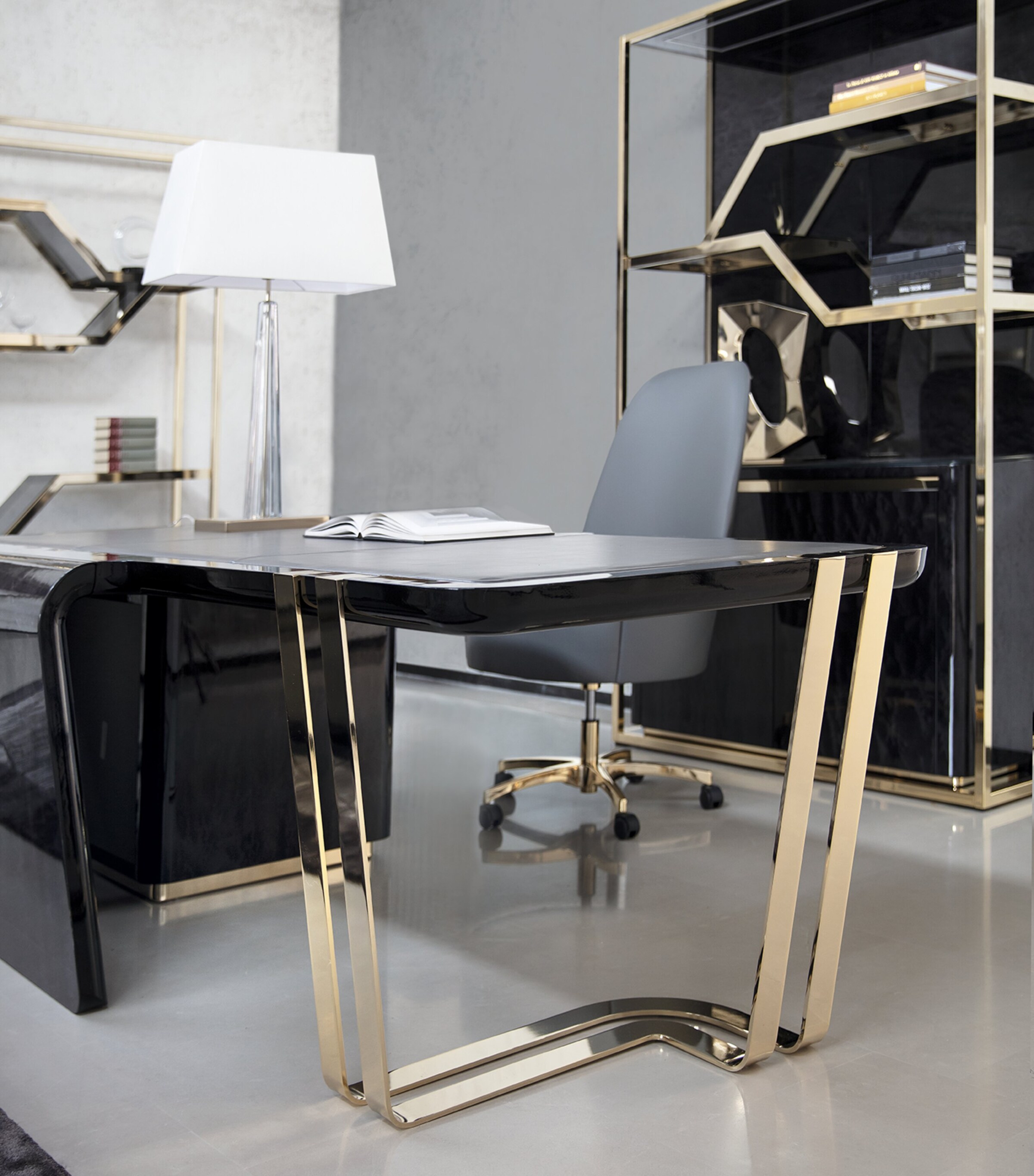 Charisma desk front with gold legs and lamp on desk