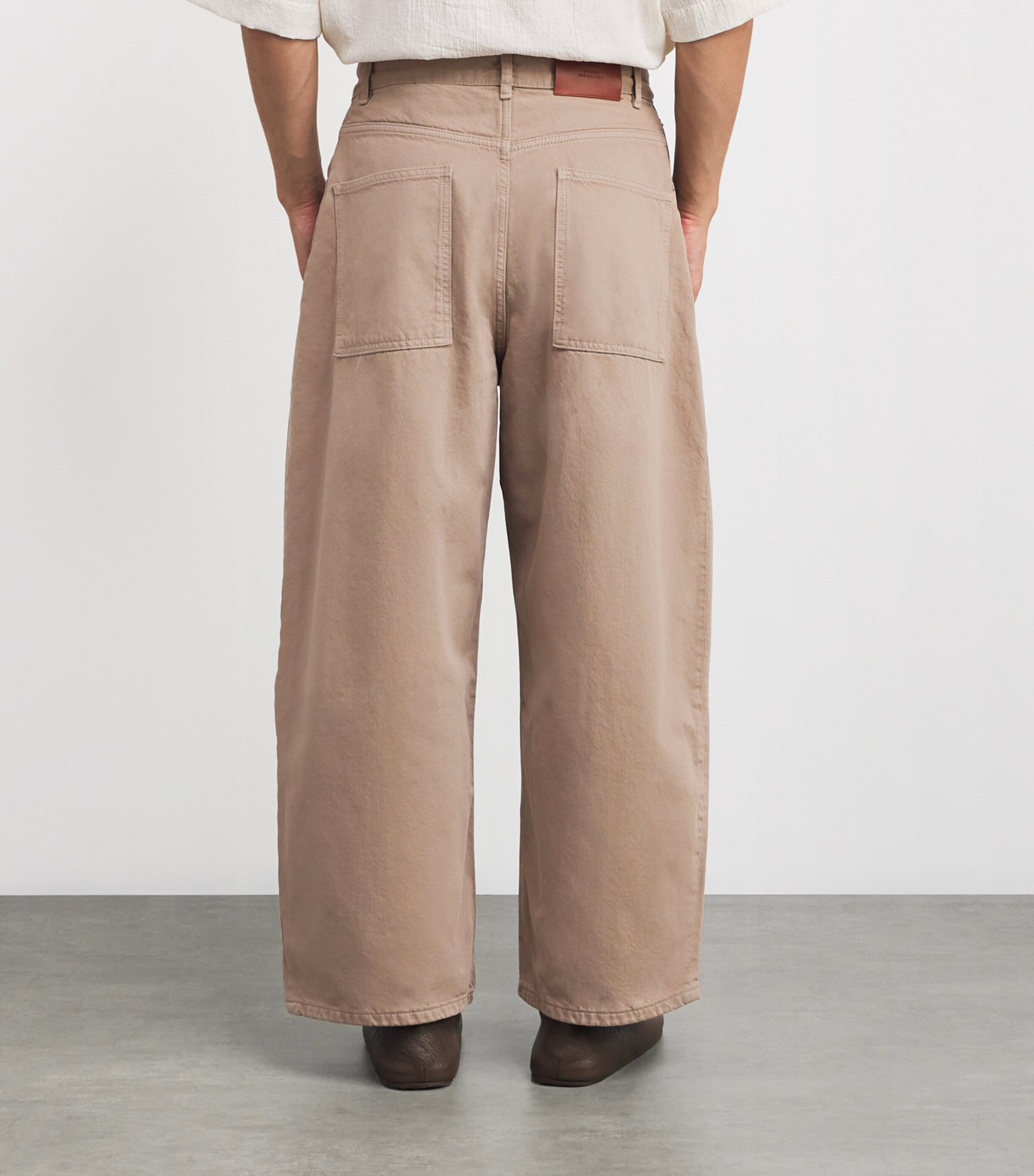 Studio Nicholson Beige Wide-Leg Paolo Jeans | Harrods UK