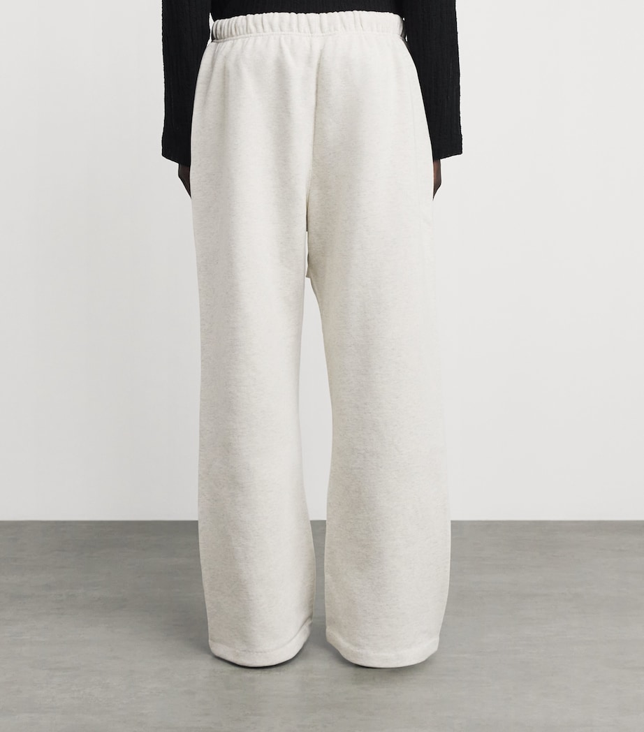 FEAR OF GOD ESSENTIALS Mens Cotton-Blend Signature Flared Sweatpants Oatml Hthr/lght Hthr Image 5