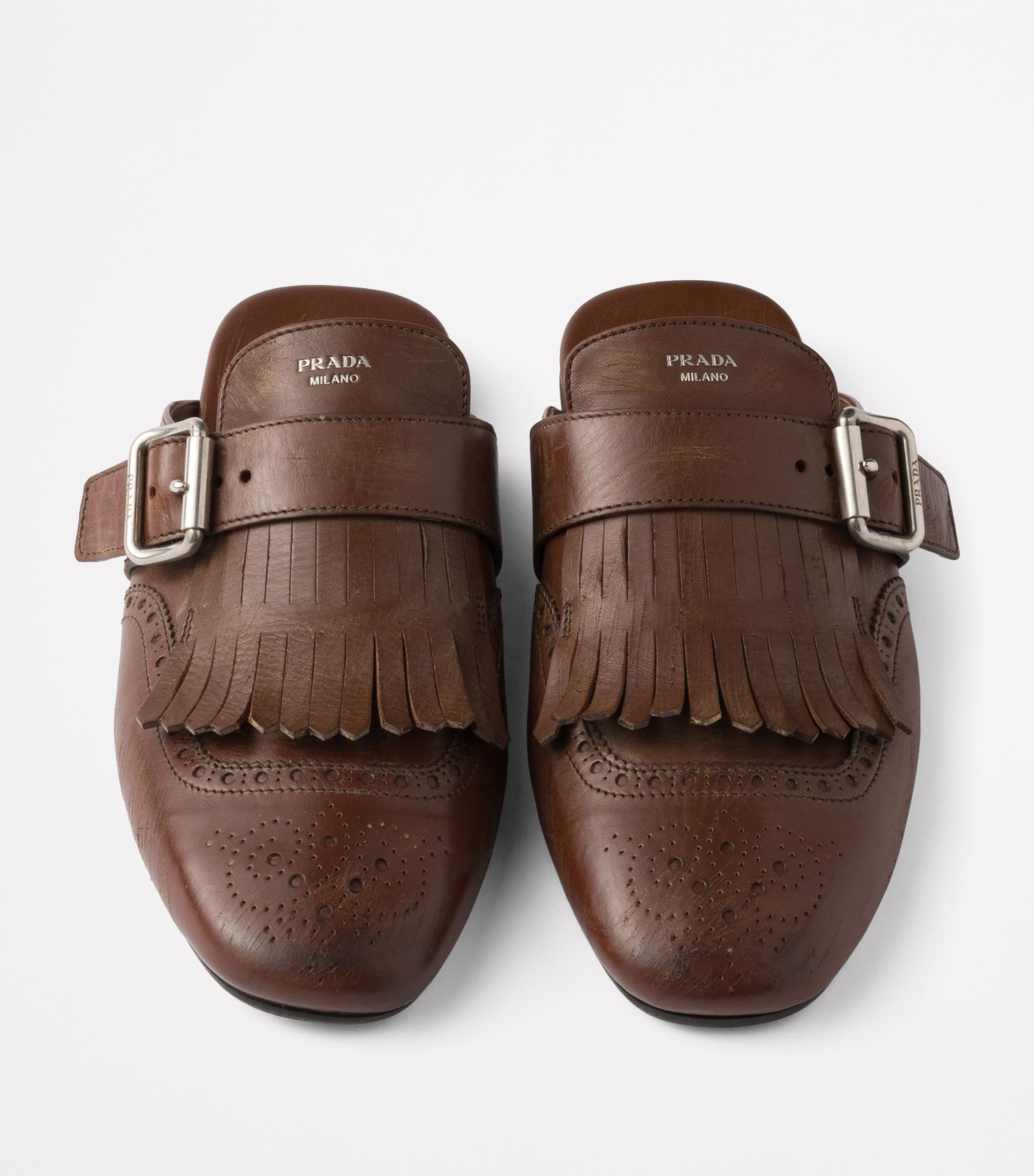Prada Leather Fringed Shuffle Mules | Harrods UK