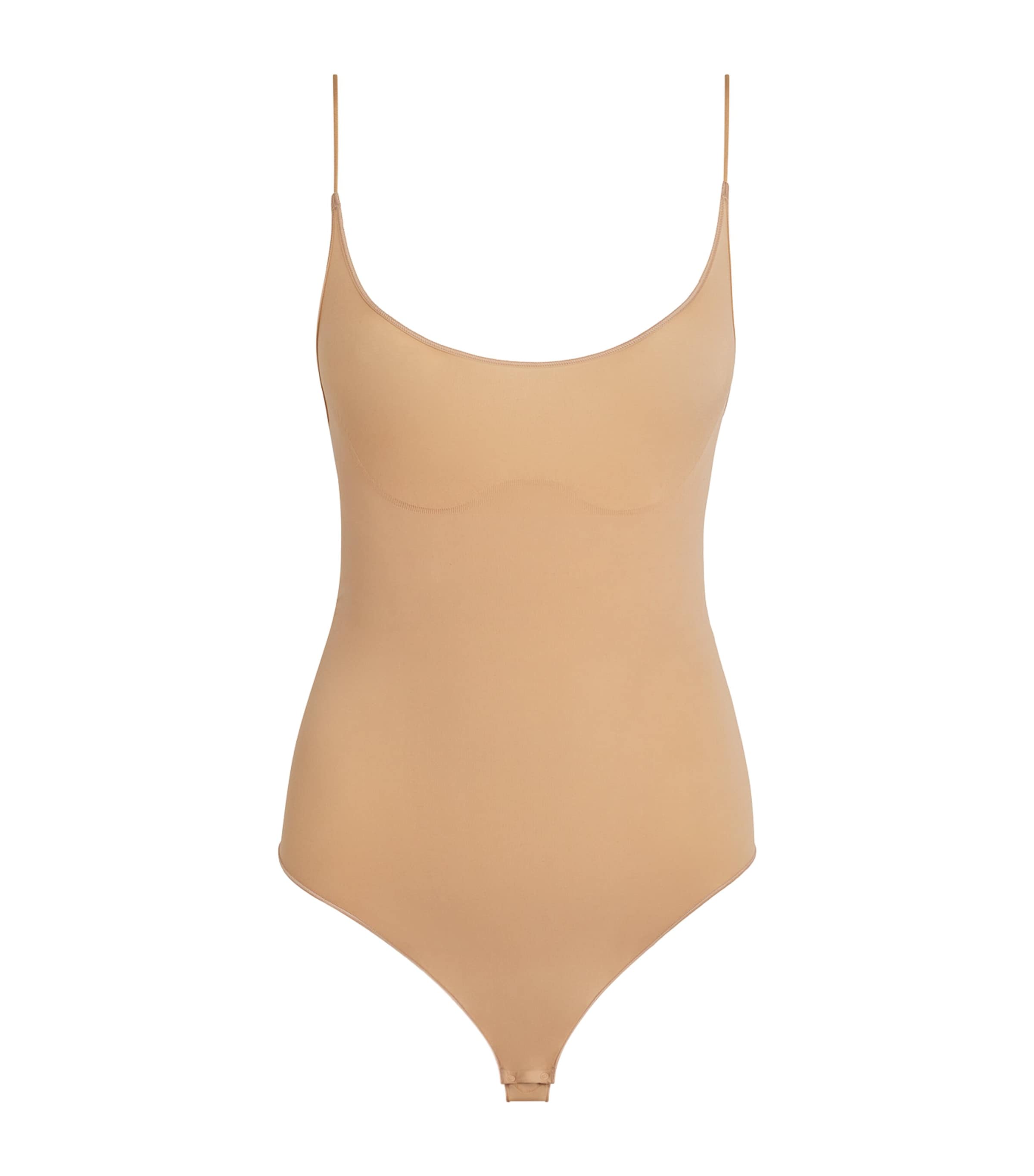 Skims Sheer Seamless Thong Bodysuit In Sand