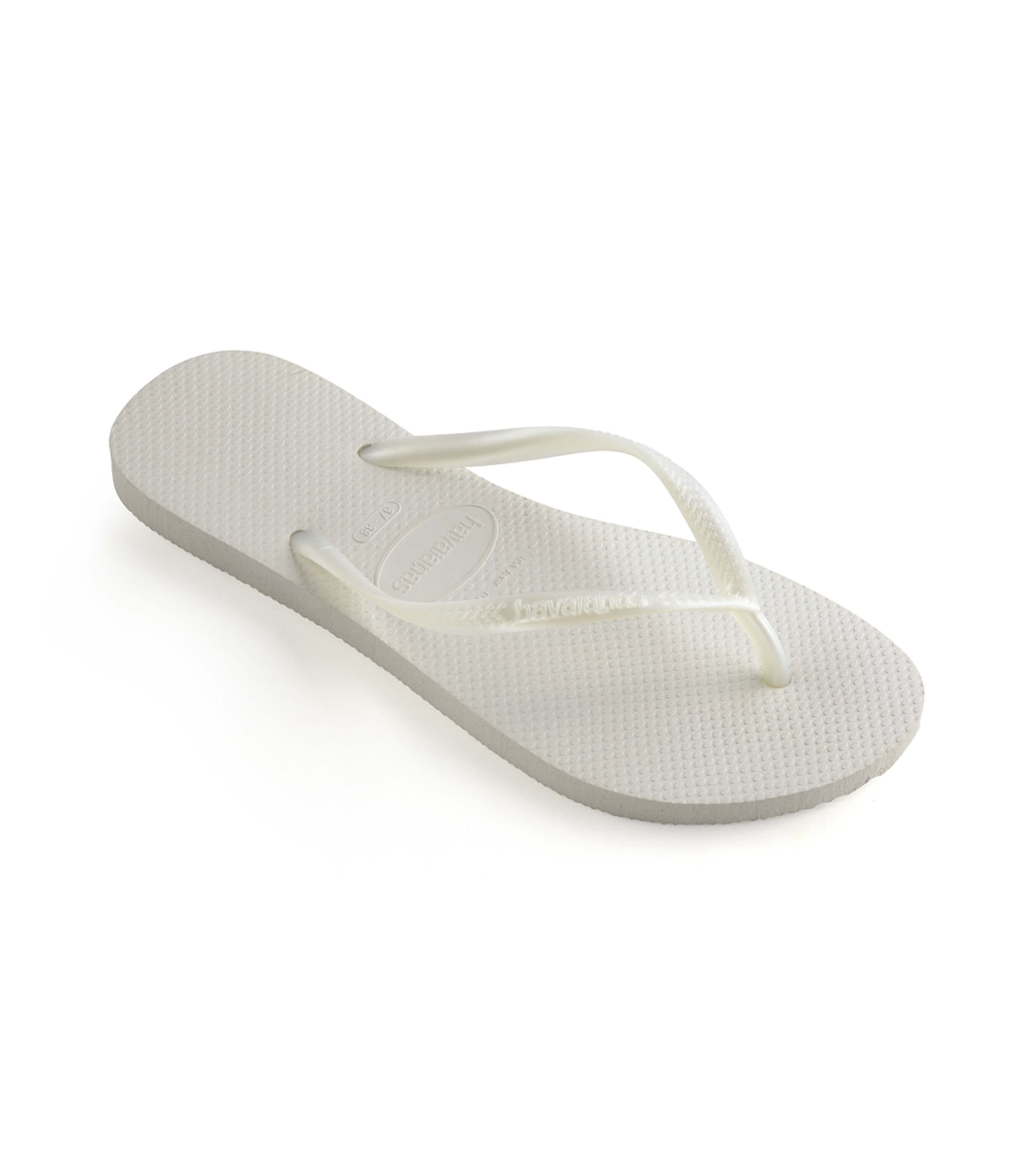 Shop Havaianas Slim Flip Flops In White